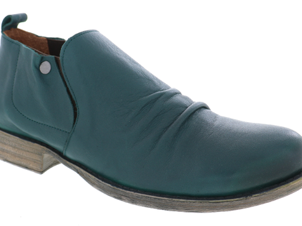 Dark green leather Ellis slip-on shoe in a three-quarter view, featuring a softly ruched vamp, elastic side panel, metal stud and low stacked heel.